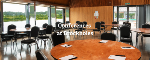 Chairs and tables in the large conference room at Brockholes